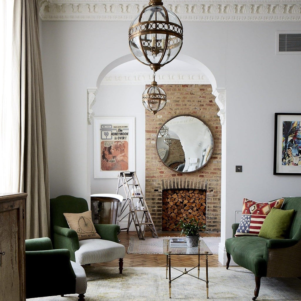 Stylish boutique hotel room with vintage-inspired decor, featuring a plush king bed, exposed brick walls, and artistic London-themed accents