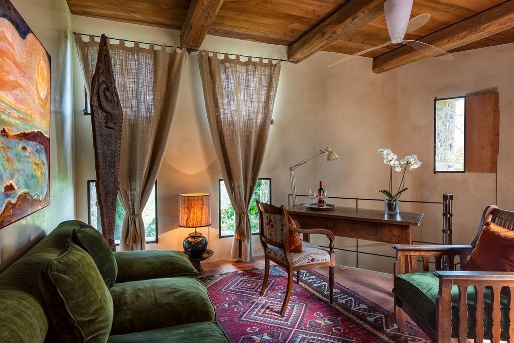 Elegant Tuscan stone villa suite with panoramic countryside views, antique furnishings, and rustic canopy bed overlooking rolling olive groves and distant hills