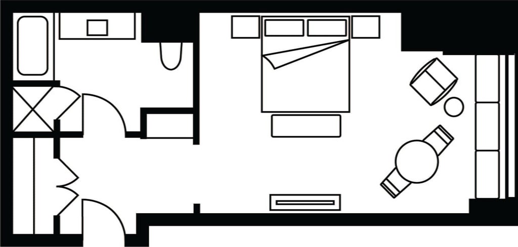 Spacious Four Seasons Miami accessible hotel room with city skyline view, featuring modern elegant design, luxurious king bed, and sleek contemporary furnishings