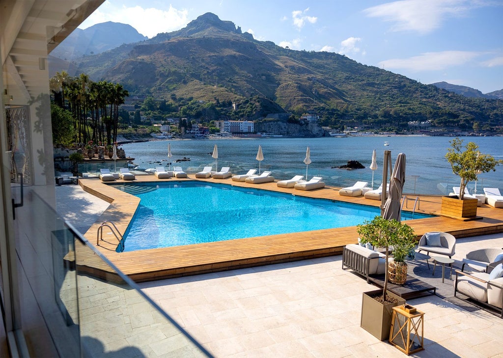 Luxurious cliffside hotel overlooking the Mediterranean Sea in Italy, featuring infinity pools and terraced balconies with panoramic views