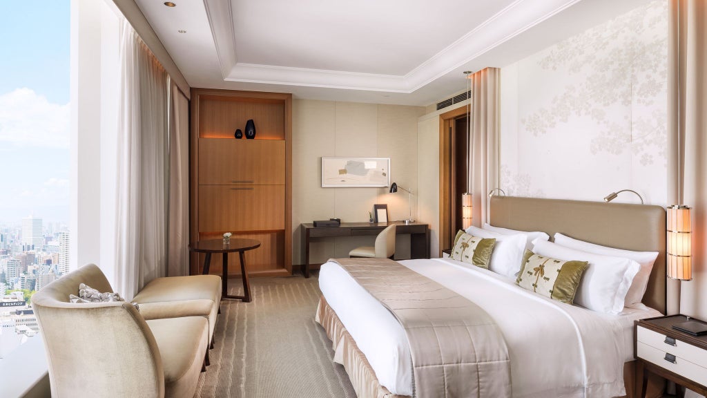 Elegant St. Regis Osaka Grand Deluxe room with plush king bed, contemporary Japanese design, city skyline view, and sophisticated neutral color palette