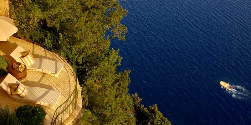 Luxurious cliffside hotel Caesar Augustus in Capri with panoramic terrace overlooking the Mediterranean Sea and Mount Vesuvius