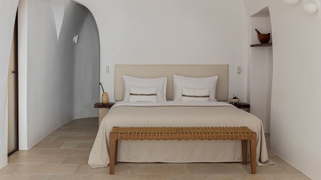 Luxurious white-washed Cycladic senior suite with private plunge pool, panoramic Aegean Sea view, minimalist design in Oia, Santorini, Greece