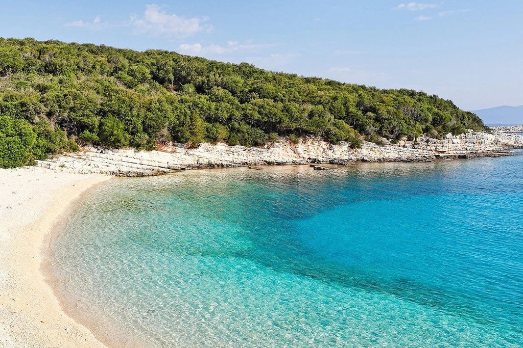 Luxurious white-stone Scenset Nature Resort nestled in lush Greek landscape, with elegant architecture, infinity pool, and panoramic Ionian Sea views