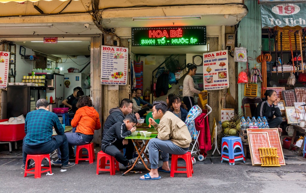 Luxurious full-day tour exploring Hanoi's vibrant Old Quarter, historic temples, and scenic streetscapes with traditional Vietnamese architecture and bustling local life.