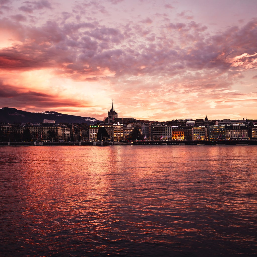 Walking tour of Geneva's elegant Old Town, showcasing historic Swiss architecture, cobblestone streets, and picturesque Alpine backdrop