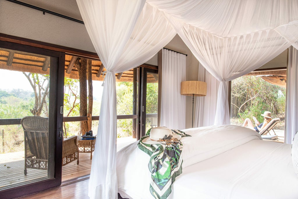 Elevated luxury safari lodge with wooden deck overlooking African savanna, featuring private plunge pool and canvas roof canopy