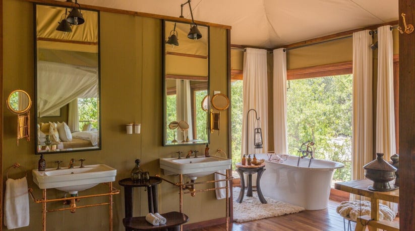 Bathe in the free-standing tub with views onto the plains around you
