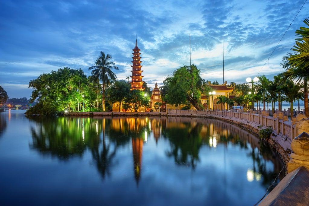 Luxurious full day tour exploring Hanoi's ancient streets, ornate temples, and colonial architecture against a vibrant backdrop of traditional Vietnamese culture and scenery.