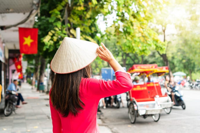 Vietnamese woman in a traditional hat
