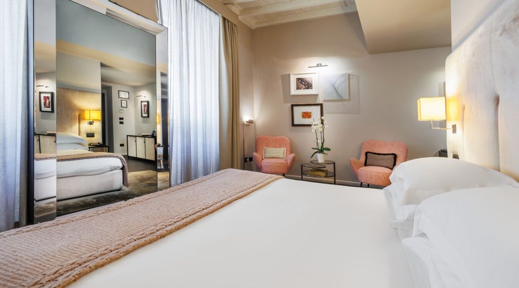 Luxurious deluxe hotel room with elegant neutral tones, ornate chandelier, plush bedding, and Italian architectural details in a historic setting