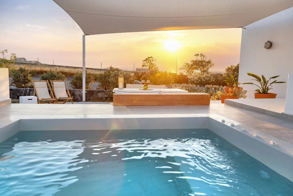 Luxurious white-washed Greek villa with blue shutters overlooking azure Aegean Sea, nestled among rocky cliffs with traditional Cycladic architectural details