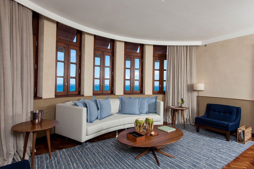 Luxurious Fasano Salvador Deluxe Ocean Front Suite with panoramic sea view, elegant contemporary design, plush king bed, and expansive floor-to-ceiling windows