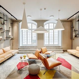 Elegant interior of Scenset Hotel Copenhagen, featuring sleek modern furniture, warm lighting, and sophisticated Nordic design elements