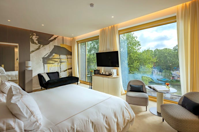 Prestige View Room with floor-to-ceiling windows overlooking the river
