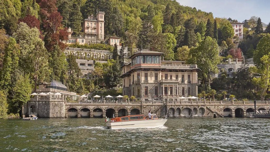 Elegant Mandarin Oriental hotel nestled on Lake Como's shore, with manicured gardens, infinity pool overlooking mountains and serene waters