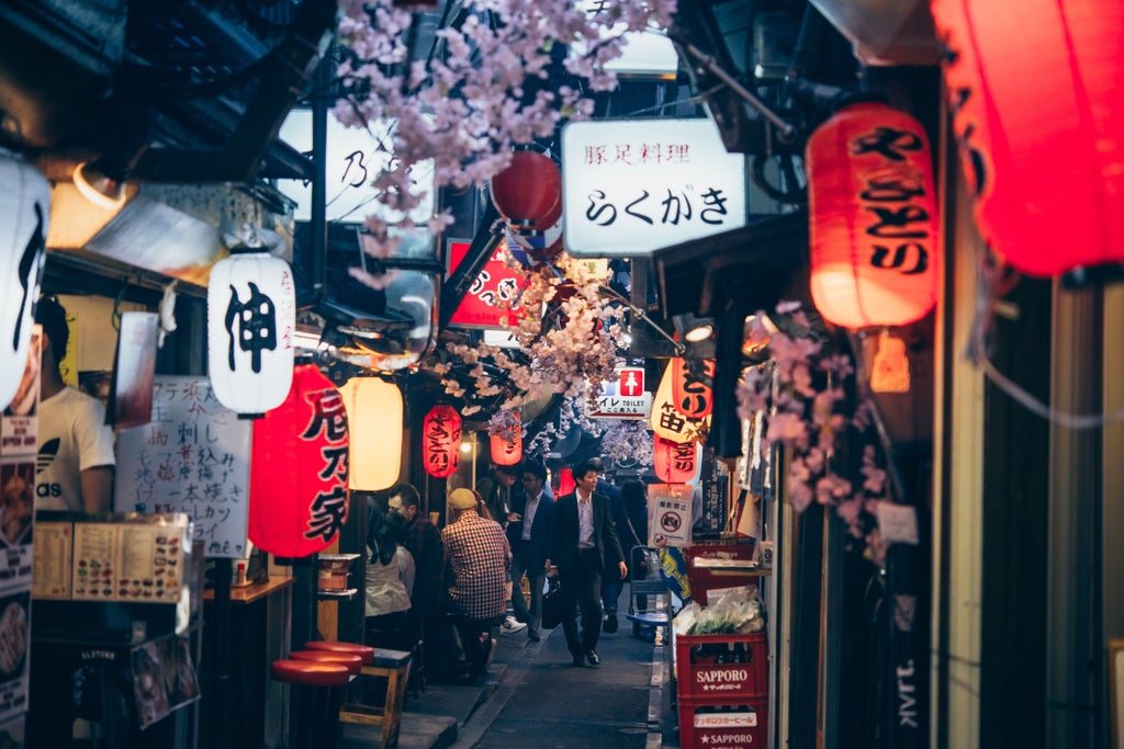 Vibrant Tokyo street at night, illuminated food stalls serving gourmet street cuisine, neon signs, and elegant travelers sampling local delicacies