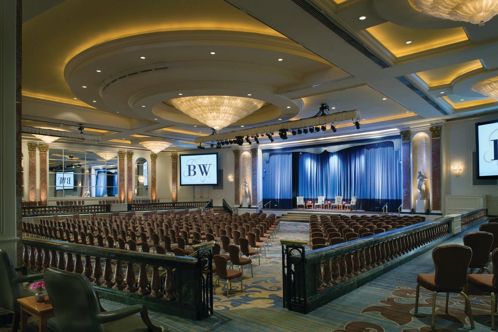 Iconic Four Seasons Beverly Wilshire hotel's grand entrance with Italian Renaissance architecture, fountain, and luxury valet service