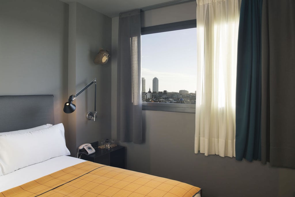 Modern hotel room with city views featuring natural light, sleek wood furniture, crisp white linens, and contemporary minimalist design