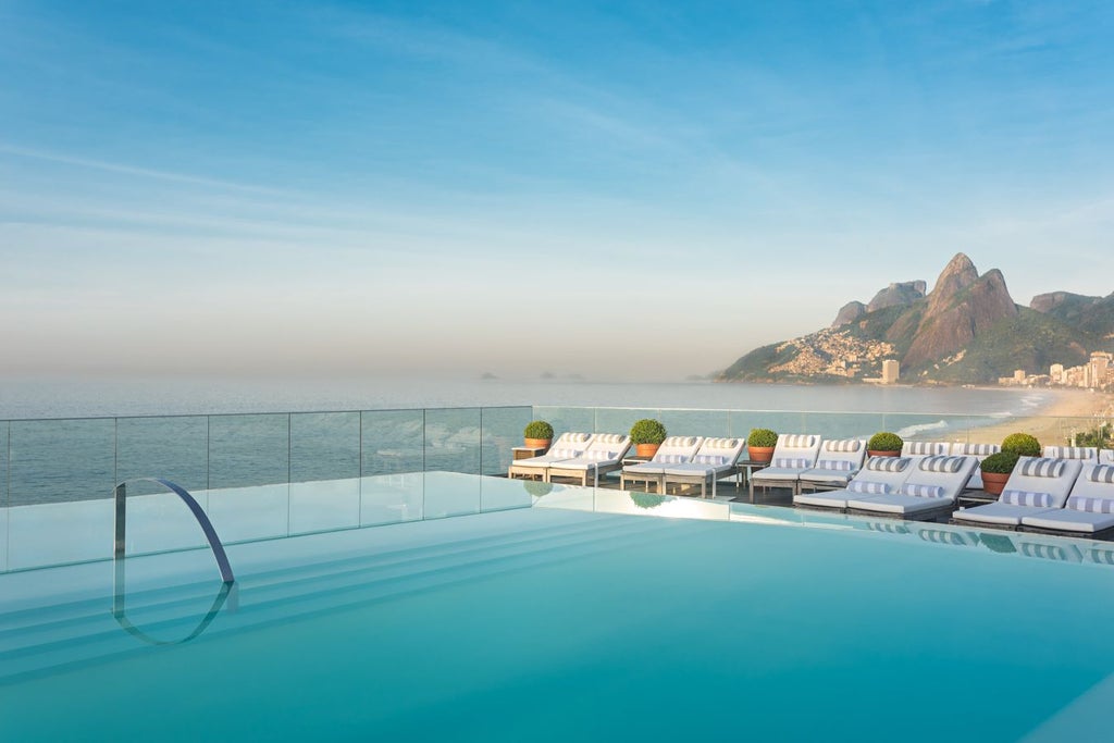 Luxurious Art Deco hotel with sweeping ocean views, sleek design, and iconic rooftop pool overlooking Ipanema Beach in Rio de Janeiro