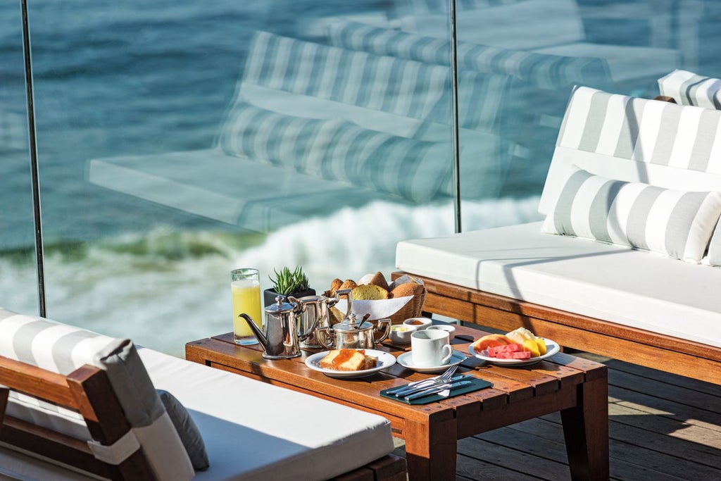 Luxury hotel overlooking Ipanema Beach, elegant Art Deco facade with white architectural design against vibrant Rio de Janeiro skyline