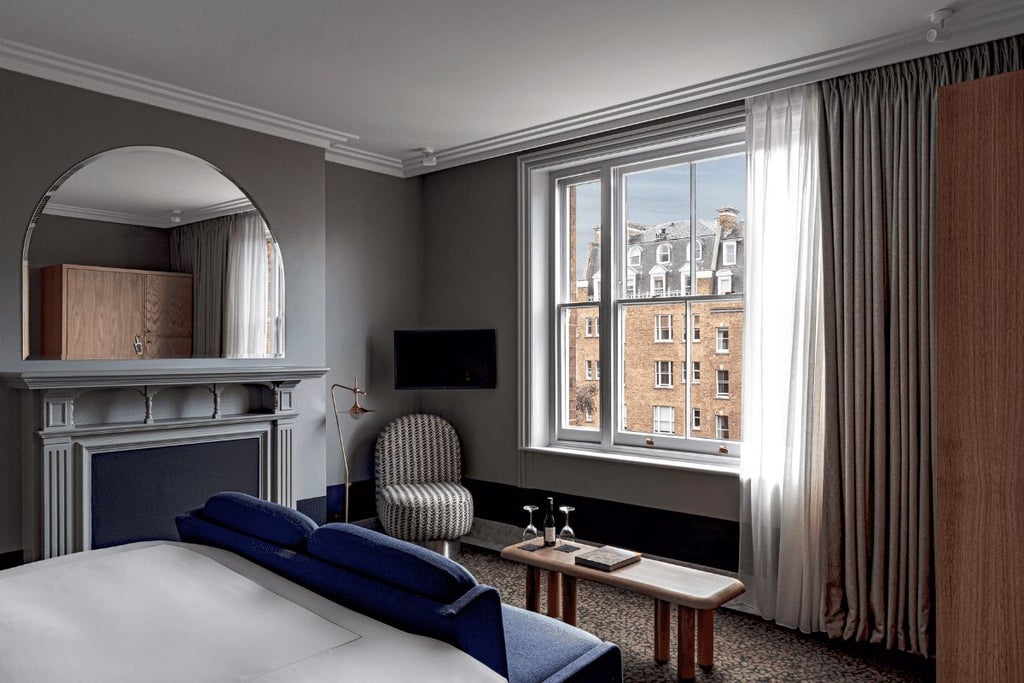 Luxurious executive hotel room with elegant contemporary design, crisp white linens, modern furnishings, and soft ambient lighting in a refined urban setting