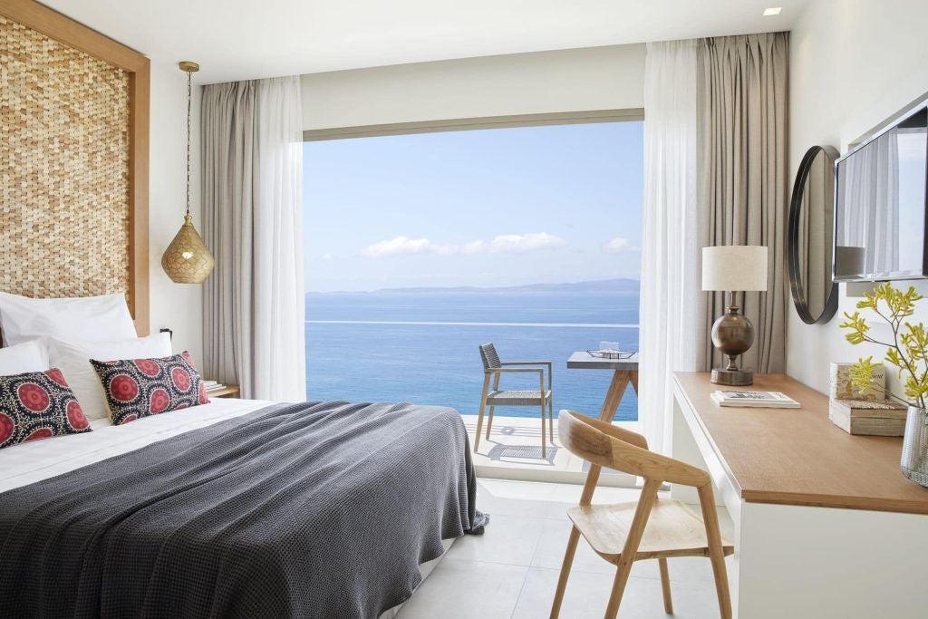 Elegant one-bedroom suite at Elix by Mar-Bella Collection, showcasing minimalist design, sea view, and contemporary Greek coastal luxury