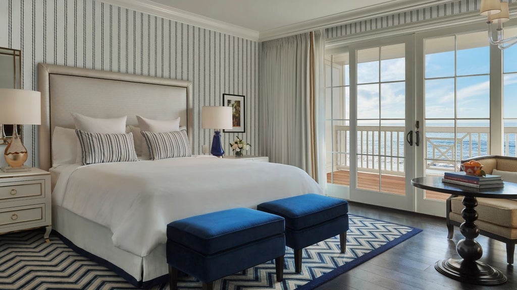 Luxurious Beach House Terrace Suite at Rosewood Miramar Beach with panoramic ocean view, elegant outdoor seating, and sophisticated coastal design.