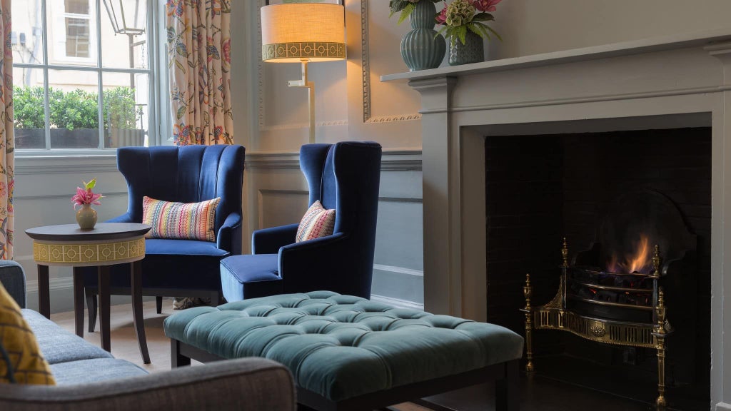 Elegant Georgian townhouse hotel with contemporary interiors, featuring warm lighting, plush furnishings, and chic design in Bath's historic city center