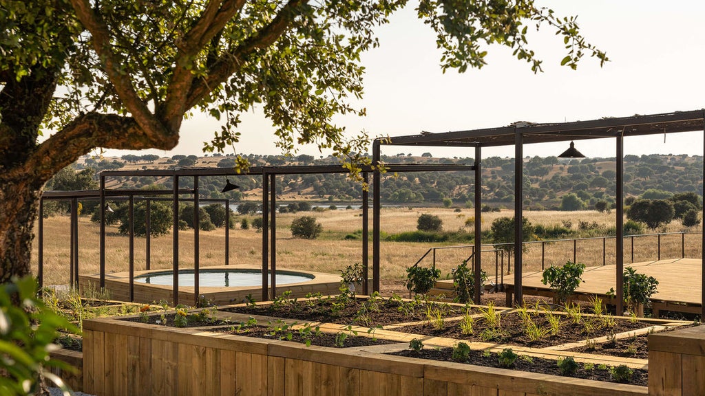 Luxury hotel exterior with sleek modern architecture, featuring a serene infinity pool surrounded by sun loungers in rural Portugal