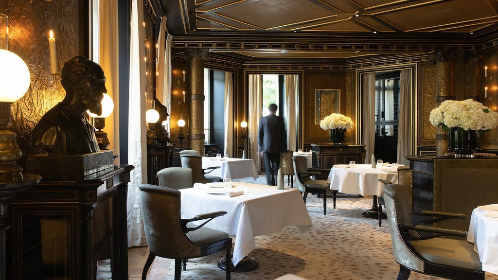 Elegant Parisian hotel interior with opulent crystal chandeliers, plush velvet furnishings, and intricate marble columns in soft neutral tones