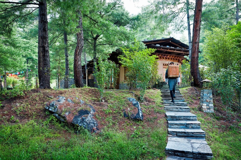 Luxurious traditional Bhutanese stone and wood hotel nestled in misty mountain landscape, blending elegant architecture with stunning Himalayan scenery