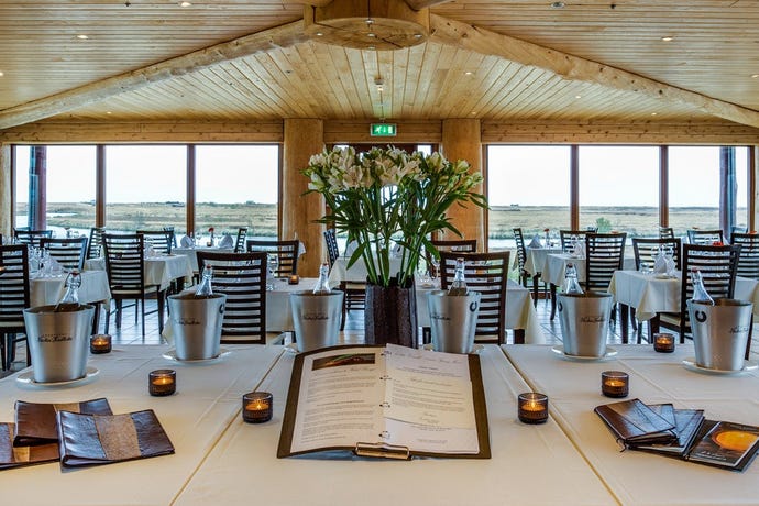 Grab dinner at Rangá Restaurant, surrounded by a panoramic view of the Icelandic landscape