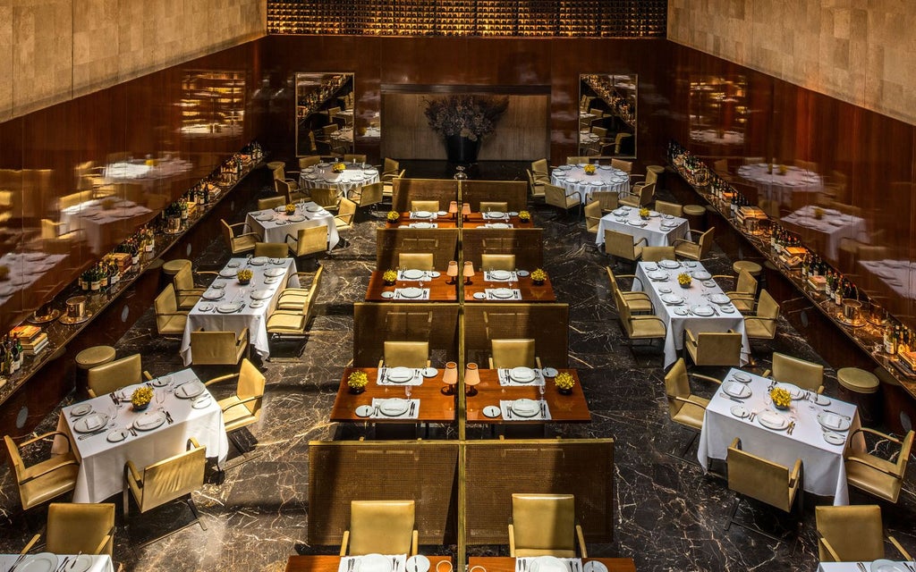 Luxurious high-rise Fasano hotel exterior in São Paulo, featuring sleek modern architecture with glass façade and urban skyline backdrop