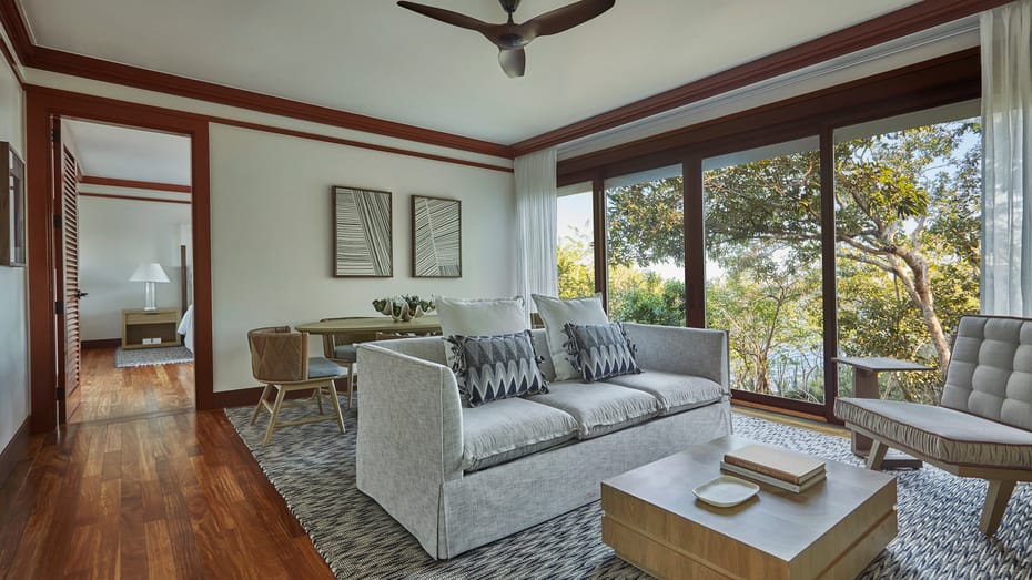 Elegant one-bedroom suite with private plunge pool overlooking lush Costa Rican forest canopy, featuring modern tropical decor