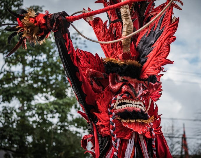 Culture served hot: this red devil performs at the Diabolicos and Congos Festival in Portobelo