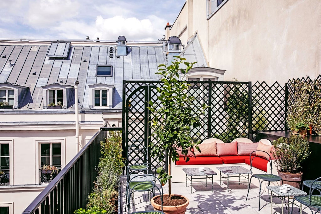 Elegant Parisian hotel with ornate balconies, soft golden lighting, and classic French architectural details along a bustling historic boulevard at dusk