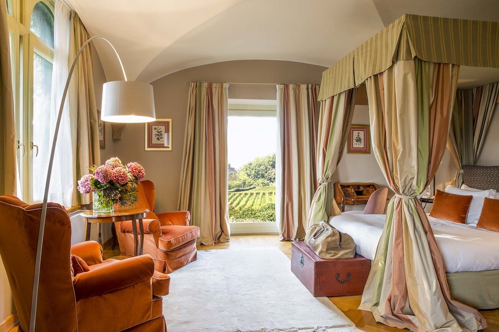 Elegant Italian luxury junior suite with panoramic vineyard views, plush king bed, modern minimalist decor, and warm natural light streaming through floor-to-ceiling windows