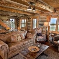 Rustic wooden lodge bedroom with king-sized bed, plush bedding, panoramic mountain views, and warm natural lighting at scenic mountain retreat