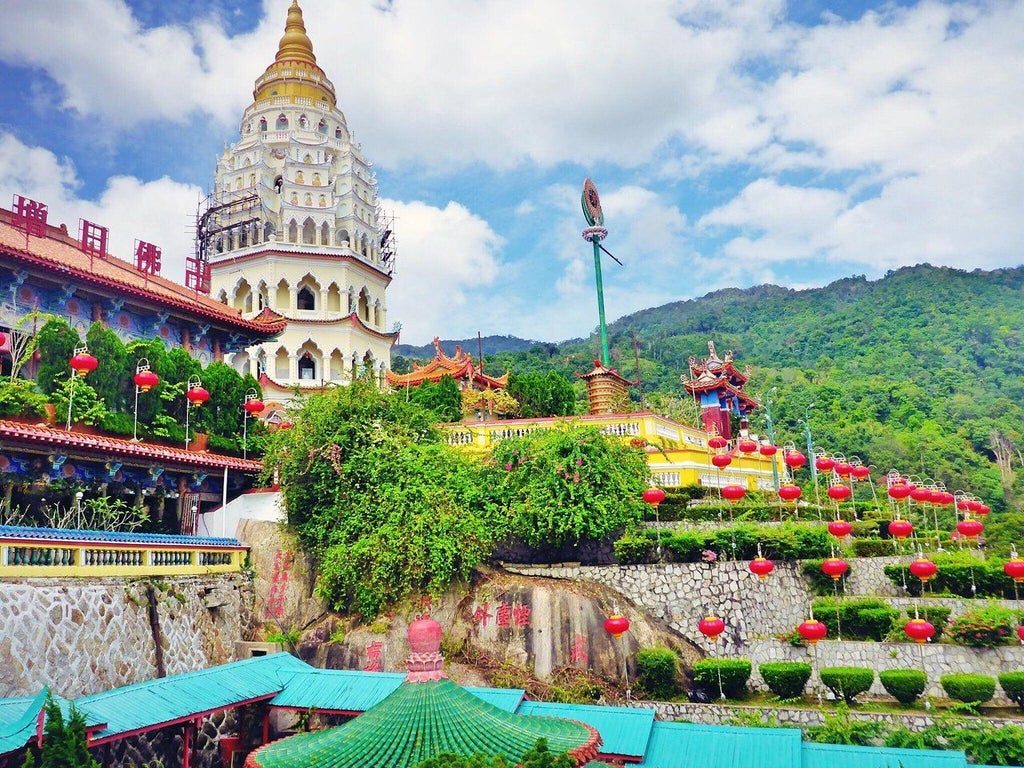 Scenic Penang cityscape with ornate temples, vibrant street art, historic Georgetown architecture, and lush tropical landscapes showcasing Malaysia's cultural heritage