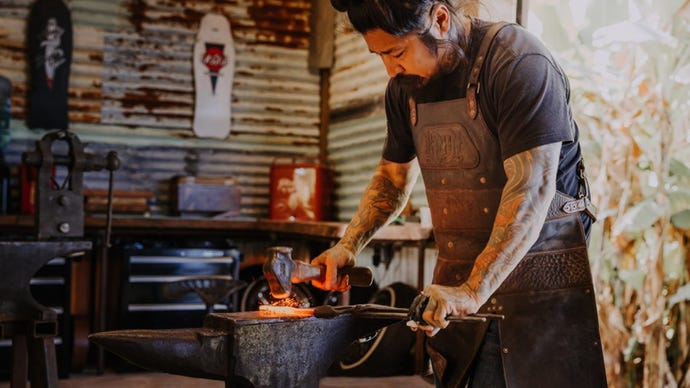 Local blacksmith Neil Kamimura forges knives on a secluded coffee farm up in the hills