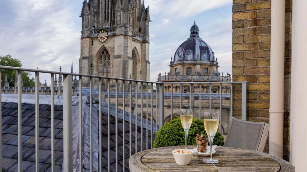 Elegant superior deluxe hotel room with private balcony, vintage architectural details, and refined decor highlighting British heritage and luxury