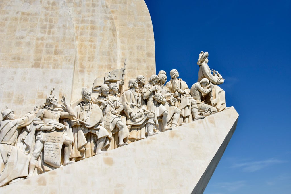 Elegant Lisbon cityscape with Belém Tower silhouette, golden sunlight, traditional pastéis de nata, and sleek modern culinary design showcasing Portugal's cultural fusion