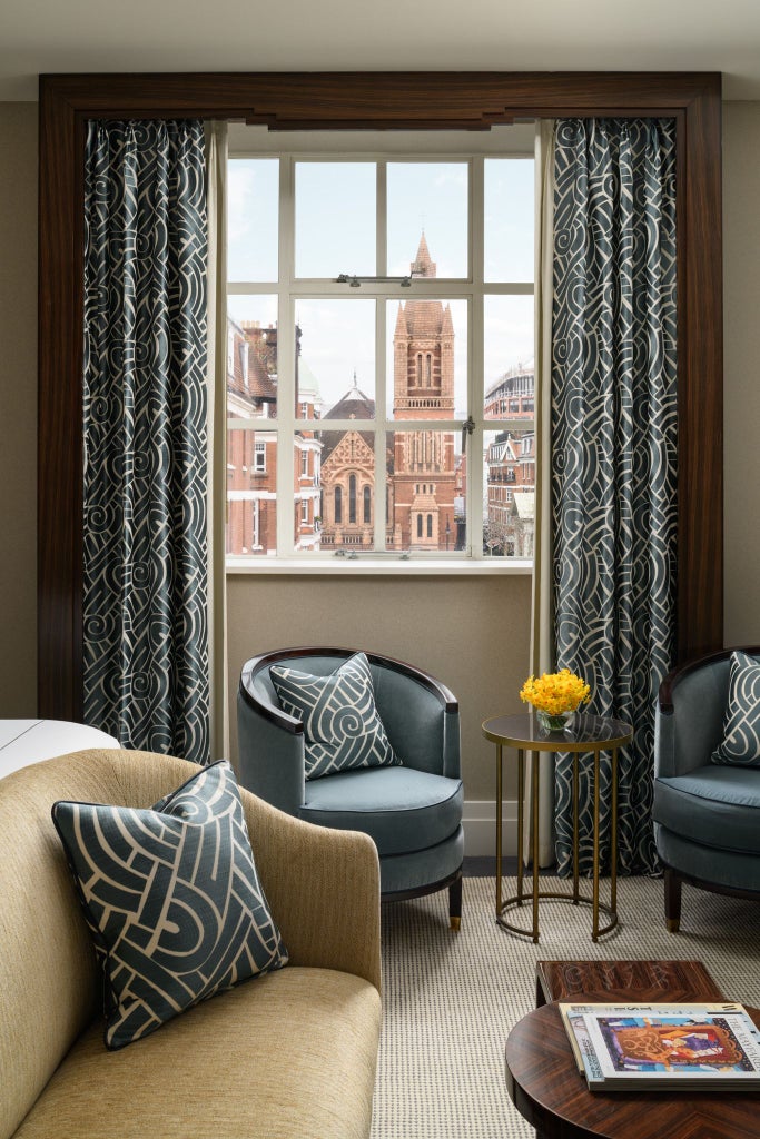 Elegant Superior Studio at The Beaumont hotel in Mayfair, featuring plush king bed, luxurious cream decor, and sophisticated modern design with soft lighting