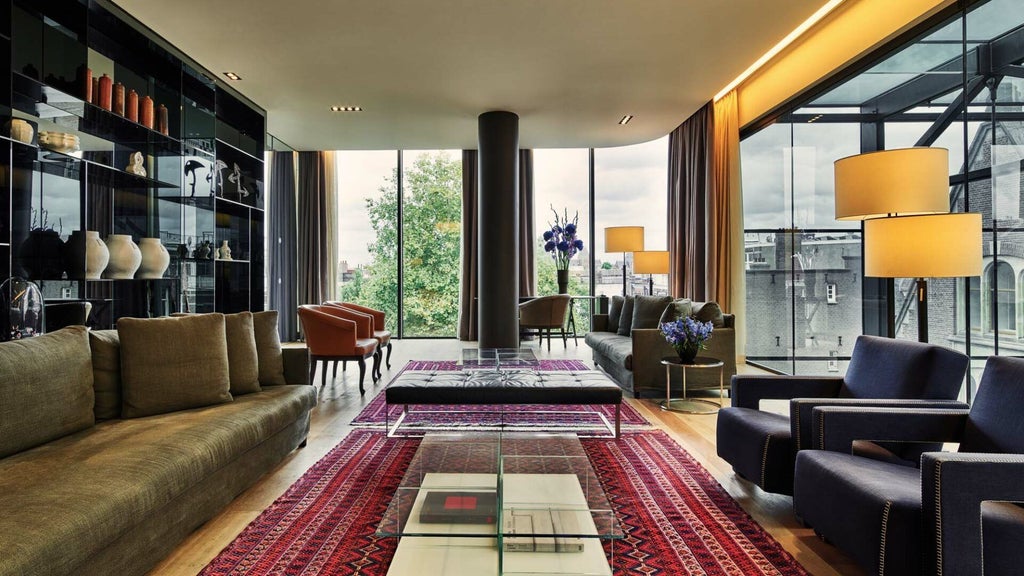 Luxurious penthouse suite at Conservatorium Hotel, Amsterdam, with modern design, floor-to-ceiling windows, and elegant contemporary furnishings in warm, neutral tones