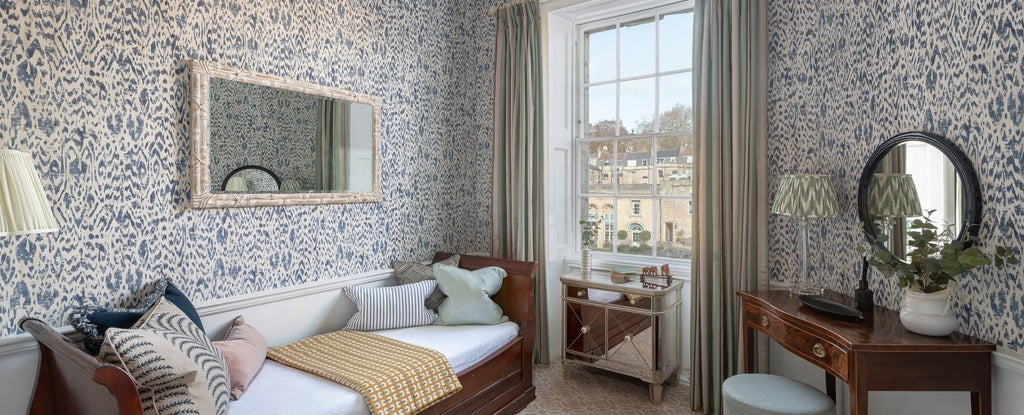 Elegant master suite at The Royal Crescent Hotel & Spa, featuring luxurious decor, plush bedding, and sophisticated architectural details in a UK heritage setting