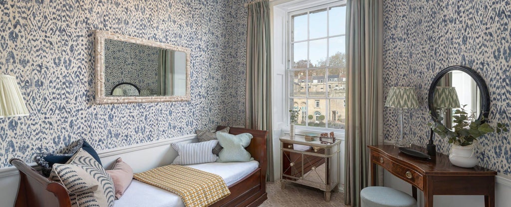 Elegant family suite at The Scenset Crescent Hotel & Spa, showcasing luxurious interiors with plush bedding, refined decor, and panoramic city views in United Kingdom