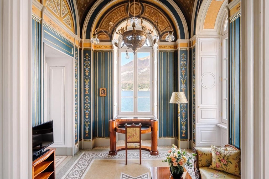 An opulent 5-star lakeside hotel in Bellagio with ornate Renaissance architecture, manicured gardens and panoramic Lake Como views