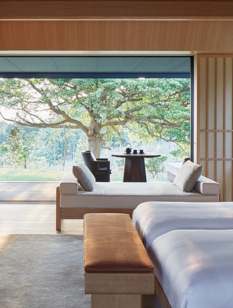 Modern Japanese luxury villa with private onsen bath overlooking Ago Bay, featuring minimalist design and traditional architecture