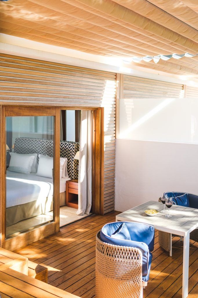 Luxurious pool corner at Gecko Hotel & Beach Club, featuring sleek loungers, tropical plants, and pristine turquoise water in coastal Spain